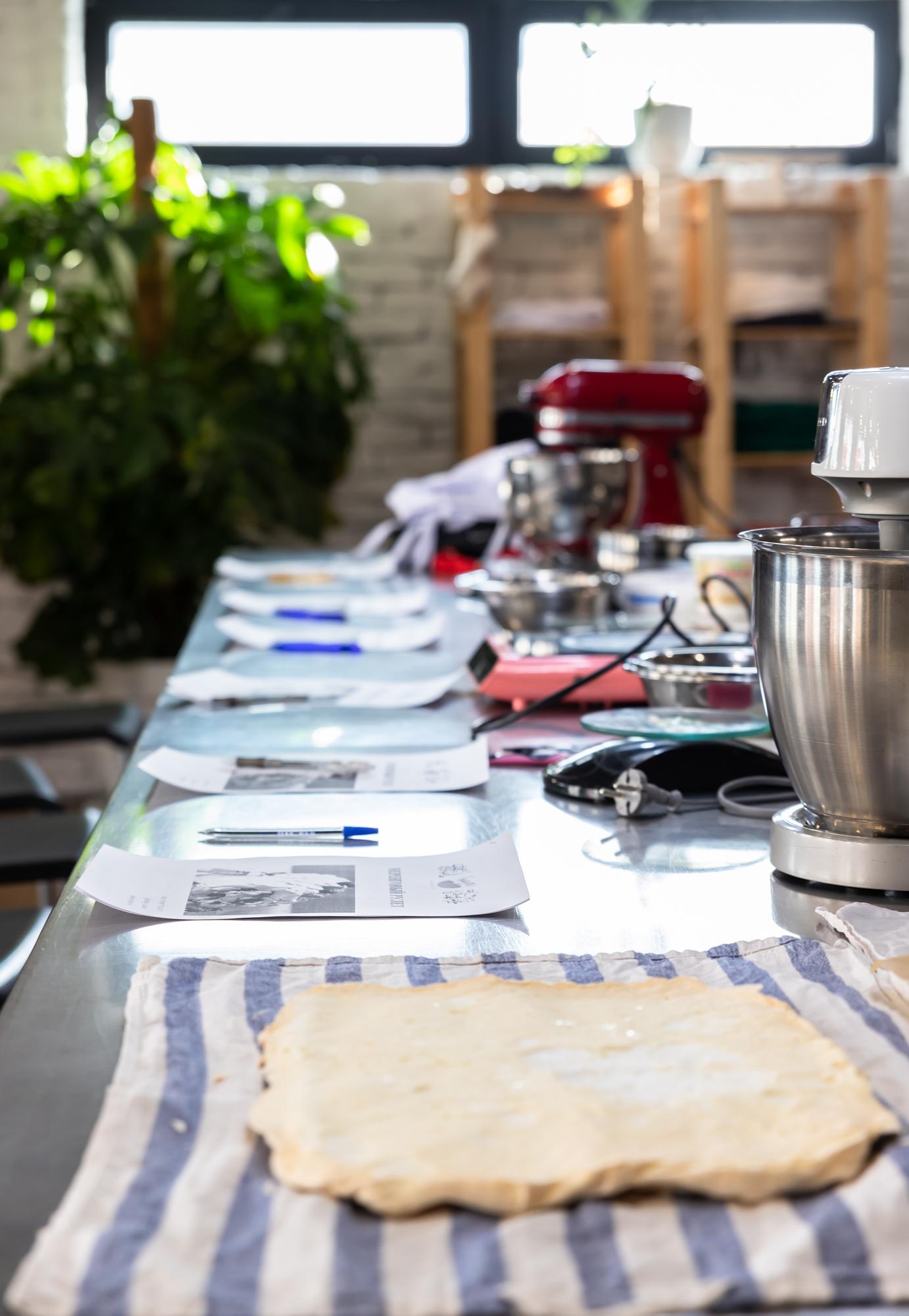 Workshop table with plated dishes and notes